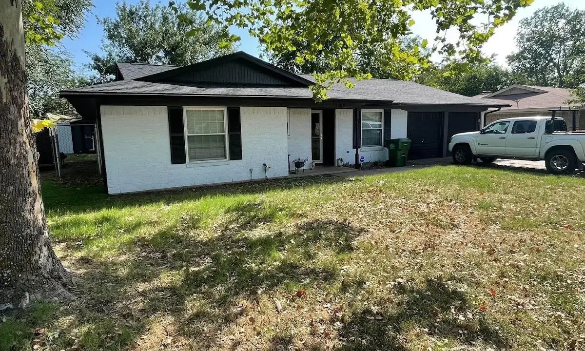 Professional roofing crew working on a residential roof in The Hammocks